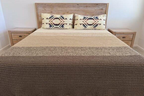 Canyon Blanket Crochet Pattern — cozy crochet blanket patterns Cozy crochet blanket patterns in a waffle texture on a bed