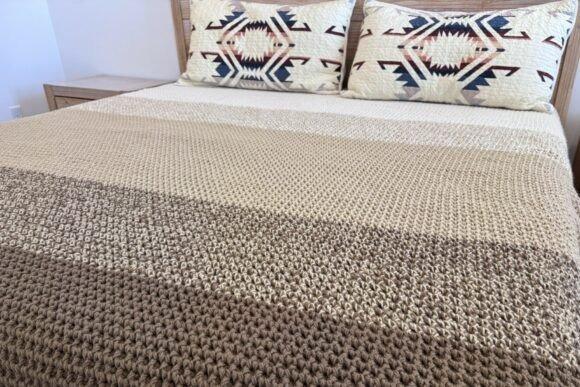 Canyon Blanket Crochet Pattern — cozy crochet blanket patterns Cozy crochet blanket pattern in waffle texture on a bed — cozy crochet blanket patterns