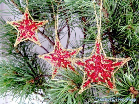 Crochet Christmas Star Ornaments — Crochet Christmas Ornaments Patterns Crochet Christmas star ornaments with lace and picot details hanging on a pine tree. — Crochet Christmas Ornaments Patterns