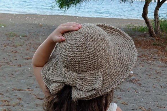 Crochet Coquette Sun Hat — crochet bucket hat patterns Crochet Coquette Sun Hat on a child at the beach — crochet bucket hat patterns