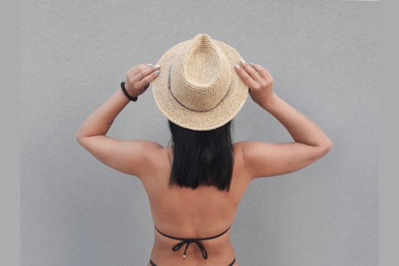 Crochet Cowboy Sun Hat — crochet hat patterns for every season Crochet Cowboy Sun Hat Pattern FedoraHat on a person from behind — crochet hat patterns for every season