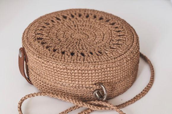 Raffia Round Crossbody Bag — crochet crossbody bag patterns Crochet crossbody bag patterns featuring a round raffia bag.