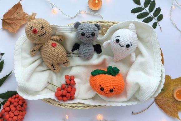 Halloween Crochet Toy Set — Crochet Halloween Patterns Crochet Halloween Patterns featuring a bat, pumpkin, ghost, and voodoo doll toys.