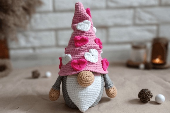 Valentine Gnome Crochet Pattern — Valentine crochet patterns Valentine crochet patterns featuring a gnome with a pink hat decorated with hearts.