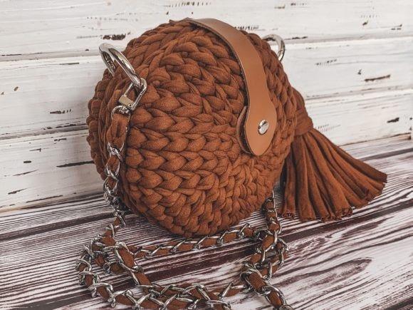 Crochet Crossbody Bag — crochet crossbody bag patterns Crochet crossbody bag made from T-shirt yarn in a round shape with a tassel. — crochet crossbody bag patterns