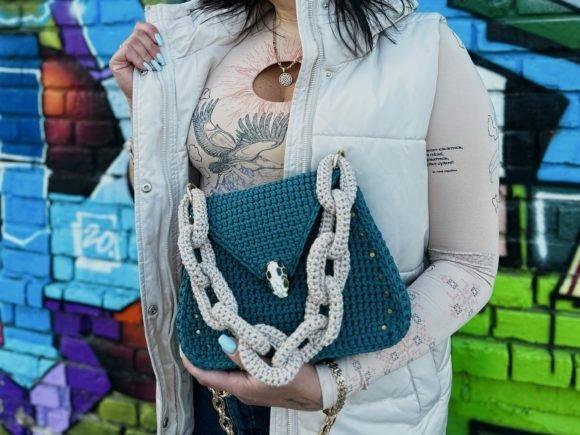 Stylish Crochet Handbag — Crochet clutch bag patterns Crochet clutch bag patterns featuring a stylish handbag with a chain strap.