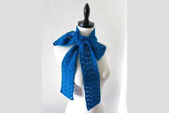 Echo Scarf Crochet Pattern — Crochet Scarf Patterns Crochet scarf in blue lace pattern styled on a mannequin. — Crochet Scarf Patterns