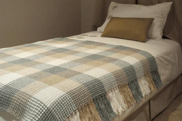 Gingham Crochet Blanket — cozy crochet blanket patterns cozy crochet blanket patterns in gingham design on a bed