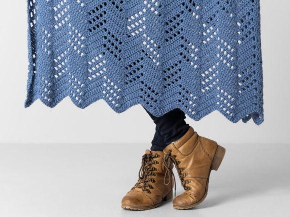 Hillside Blanket Crochet Pattern — cozy crochet blanket patterns Cozy crochet blanket patterns featuring a chevron design in blue yarn.