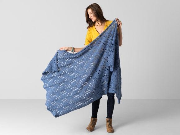 Hillside Blanket Crochet Pattern — cozy crochet blanket patterns Cozy crochet blanket patterns featuring a chevron design in blue.