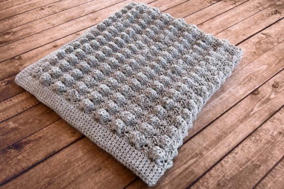 Lovey Crochet Baby Blanket — cozy crochet blanket patterns Cozy crochet blanket with raised bobbles in gray yarn — cozy crochet blanket patterns