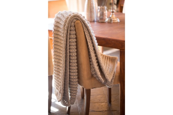 Cozy Crochet Blanket — cozy crochet blanket patterns Cozy crochet blanket draped over a chair — cozy crochet blanket patterns