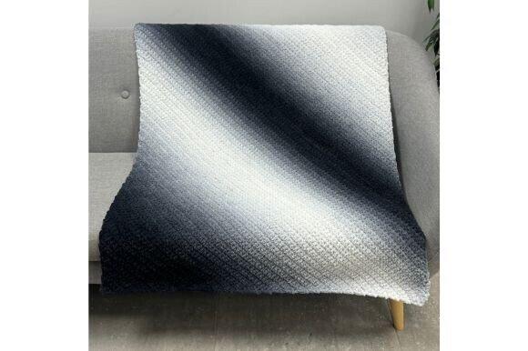 Perfect Phasing Diagonal Blanket — cozy crochet blanket patterns cozy crochet blanket patterns in gradient yarn on a sofa
