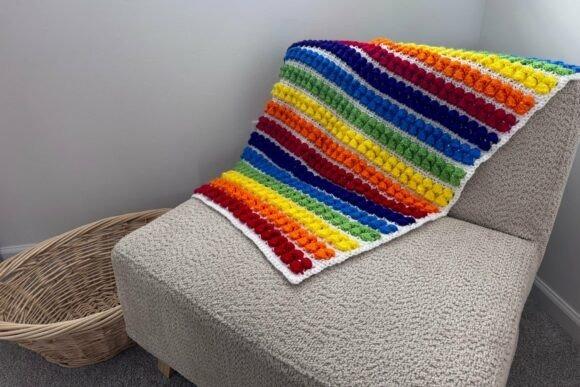Rainbow Baby Blanket Crochet Pattern — cozy crochet blanket patterns Cozy crochet blanket patterns featuring a rainbow design with textured stitches.