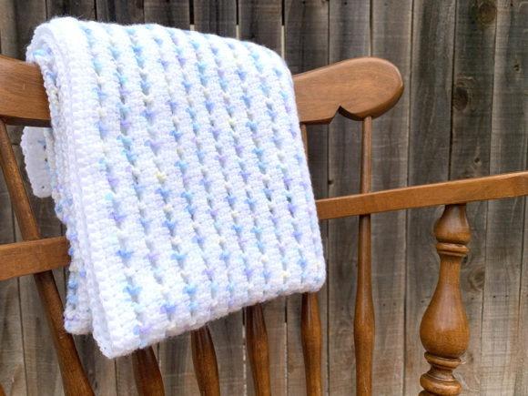 Sherbet Baby Blanket Crochet Pattern — cozy crochet blanket patterns Cozy crochet blanket in pastel colors draped over a wooden chair. — cozy crochet blanket patterns