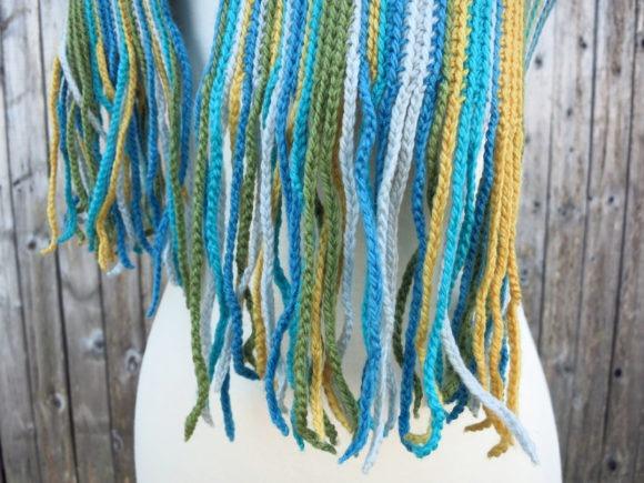 Simply Striped Scarf — Crochet Scarf Patterns Crochet scarf with integrated fringe in blue and green stripes — Crochet Scarf Patterns