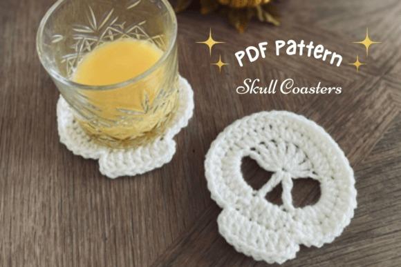 Skull Coaster Crochet Pattern — Crochet Halloween Patterns Crochet skull coaster next to a glass of drink — Crochet Halloween Patterns