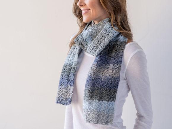 Slanting Squares Scarf — Crochet Scarf Patterns Crochet scarf in shades of blue and gray worn by a woman — Crochet Scarf Patterns