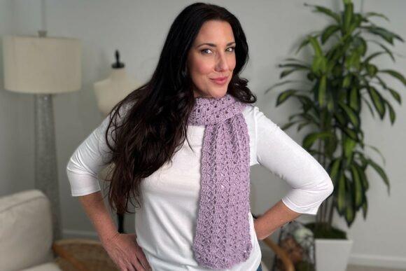 Crochet Scarf Patterns Crochet scarf in light purple worn by a model. — Crochet Scarf Patterns