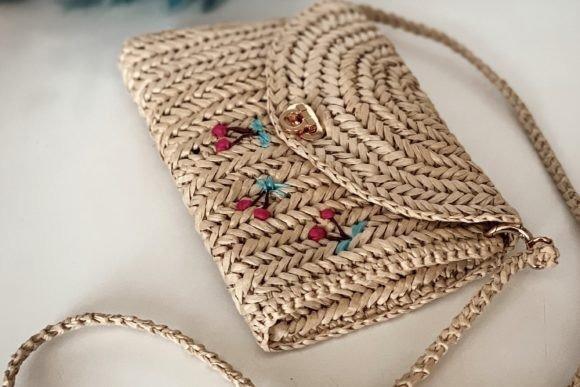Raffia Clutch Bag — Crochet clutch bag patterns Crochet clutch bag patterns featuring a raffia clutch with floral accents.