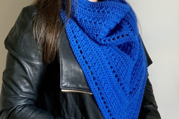 Alapi Triangle Cowl — crochet shawl patterns Crochet shawl pattern featuring a blue Alapi Triangle Cowl worn by a model. — crochet shawl patterns