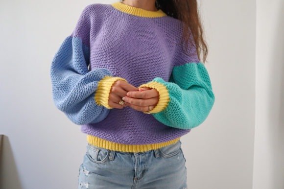 Color Block Crochet Sweater — crochet sweater patterns Crochet sweater with balloon sleeves in purple, teal, and yellow. — crochet sweater patterns