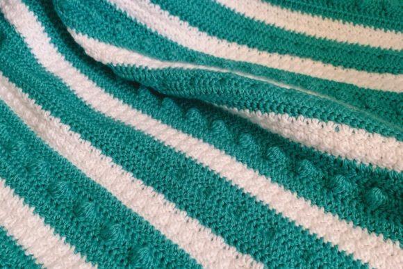 Double Trouble Bobble Baby Blanket — cozy crochet blanket patterns Cozy crochet blanket patterns featuring a textured design with bobbles.