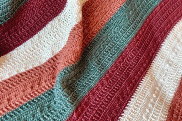 Jaske Throw Blanket — cozy crochet blanket patterns Cozy crochet blanket with textured stripes in warm colors. — cozy crochet blanket patterns