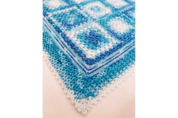 Granny Square Blanket — cozy crochet blanket patterns Cozy crochet blanket patterns featuring granny square design in blue tones.