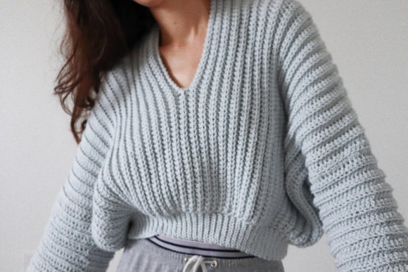 Super Slouchy Sweater — crochet sweater patterns Crochet sweater pattern featuring a slouchy silhouette in light blue. — crochet sweater patterns