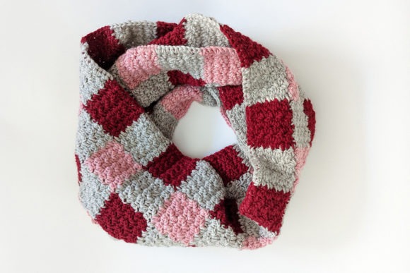 Plaid Infinity Scarf — Crochet Scarf Patterns Crochet scarf with a three-color plaid design in red, pink, and gray. — Crochet Scarf Patterns