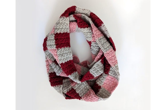 Truly Plaidly Deeply Infinity Scarf — Crochet Scarf Patterns Crochet scarf featuring a three-color plaid design in shades of red, pink, and gray. — Crochet Scarf Patterns