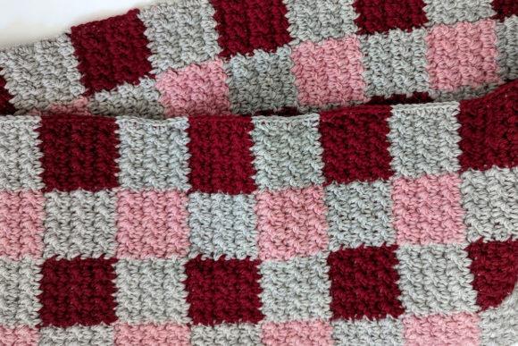 Plaid Infinity Scarf Design — Crochet Scarf Patterns Crochet scarf with a three-color plaid design in red, pink, and gray. — Crochet Scarf Patterns