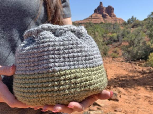 Vista Woven Basket — crochet basket patterns Crochet basket in gray and green held outdoors — crochet basket patterns