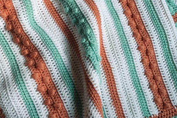 Candy Clouds Baby Blanket — Crochet Baby Blanket Patterns Crochet Baby Blanket Patterns featuring textured stitches in pastel colors.