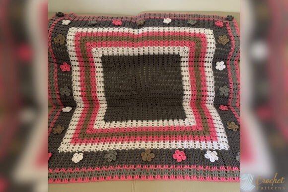Crochet Baby Blanket Patterns Crochet Baby Blanket Patterns featuring a square design with floral accents.