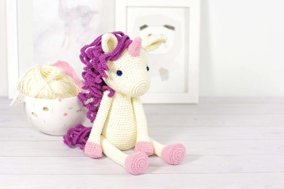 Crocheted Unicorn Amigurumi — Cute Animal Amigurumi Patterns Cute Animal Amigurumi Patterns featuring a crocheted unicorn with movable limbs.