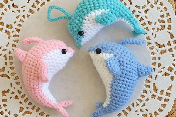 Dolphin Crochet Patterns — Cute Animal Amigurumi Patterns Cute Animal Amigurumi Patterns featuring dolphin crochet designs in pink and blue.