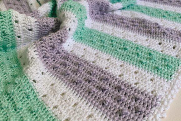 Pretty Picot Baby Blanket — Crochet Baby Blanket Patterns Crochet baby blanket with a textured surface in green and white stripes. — Crochet Baby Blanket Patterns