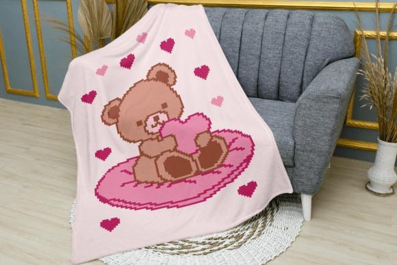 Teddy Bear Crochet Blanket — 25 Crochet Baby Blanket Patterns 25 Crochet Baby Blanket Patterns featuring a teddy bear holding a heart
