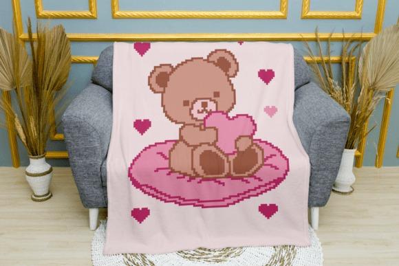 Teddy Bear Crochet Blanket Pattern — 25 Crochet Baby Blanket Patterns 25 Crochet Baby Blanket Patterns featuring a teddy bear holding a heart