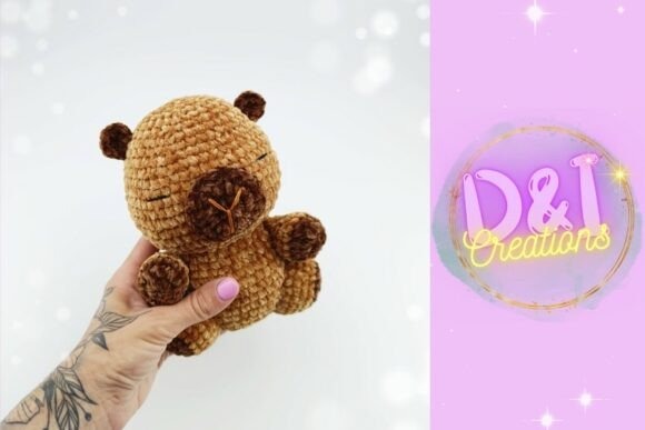 Amigurumi Patterns Amigurumi capybara crochet toy in hand — amigurumi patterns