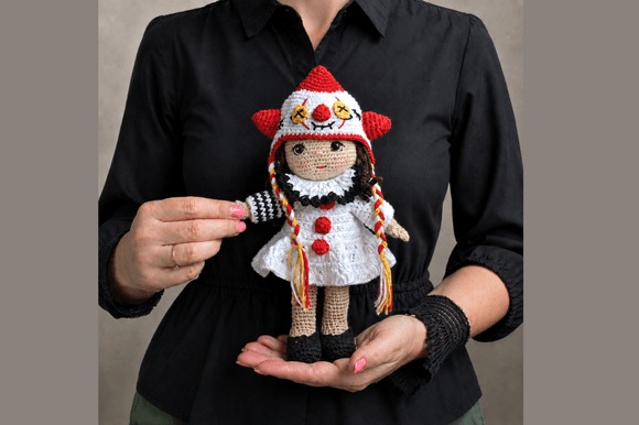 Festive Crochet Doll Pattern — amigurumi patterns Festive Crochet Doll pattern showcasing a holiday-themed character in a white dress. — amigurumi patterns