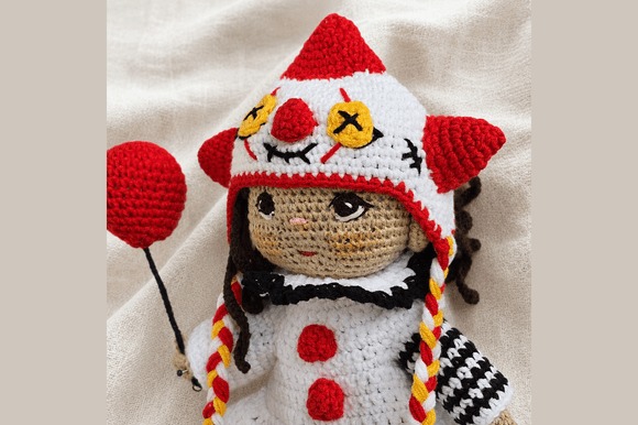 Festive Crochet Doll Pattern — amigurumi patterns Festive crochet doll with red balloon and clown hat — amigurumi patterns
