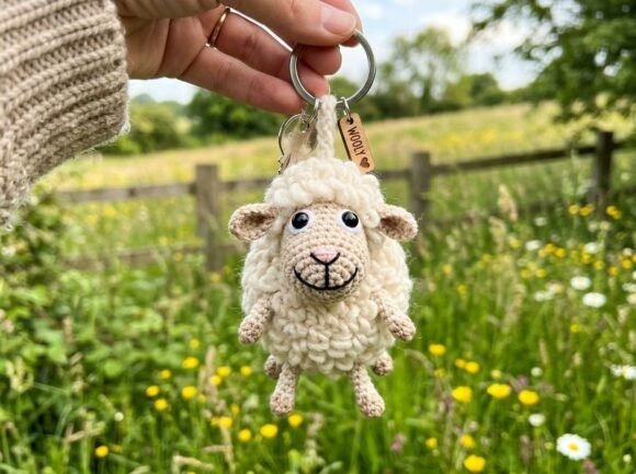 Crochet Amigurumi Keychain Sheep Crochet amigurumi keychain of a sheep held in hand