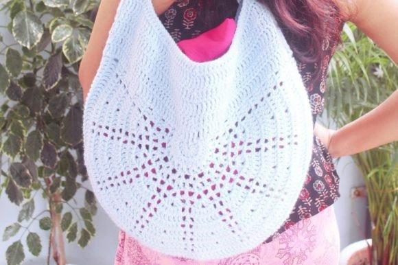 Crochet Bag Patterns Crochet bag patterns featuring a light blue tote bag with a spacious design.