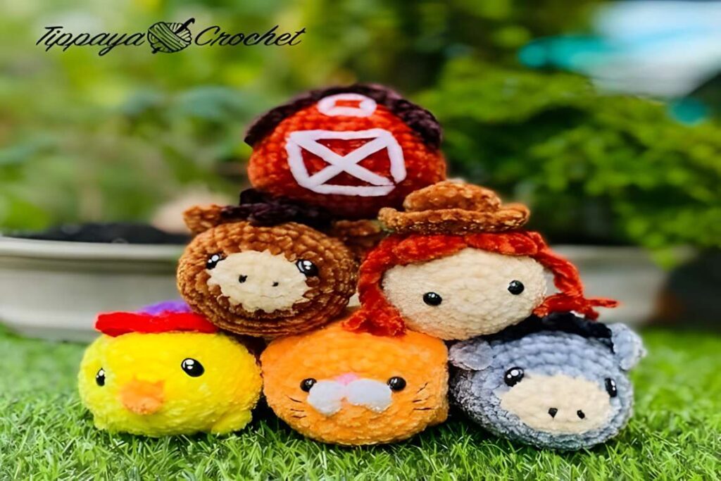 Amigurumi crochet patterns featuring farm animals including a barn, chick, and donkey.