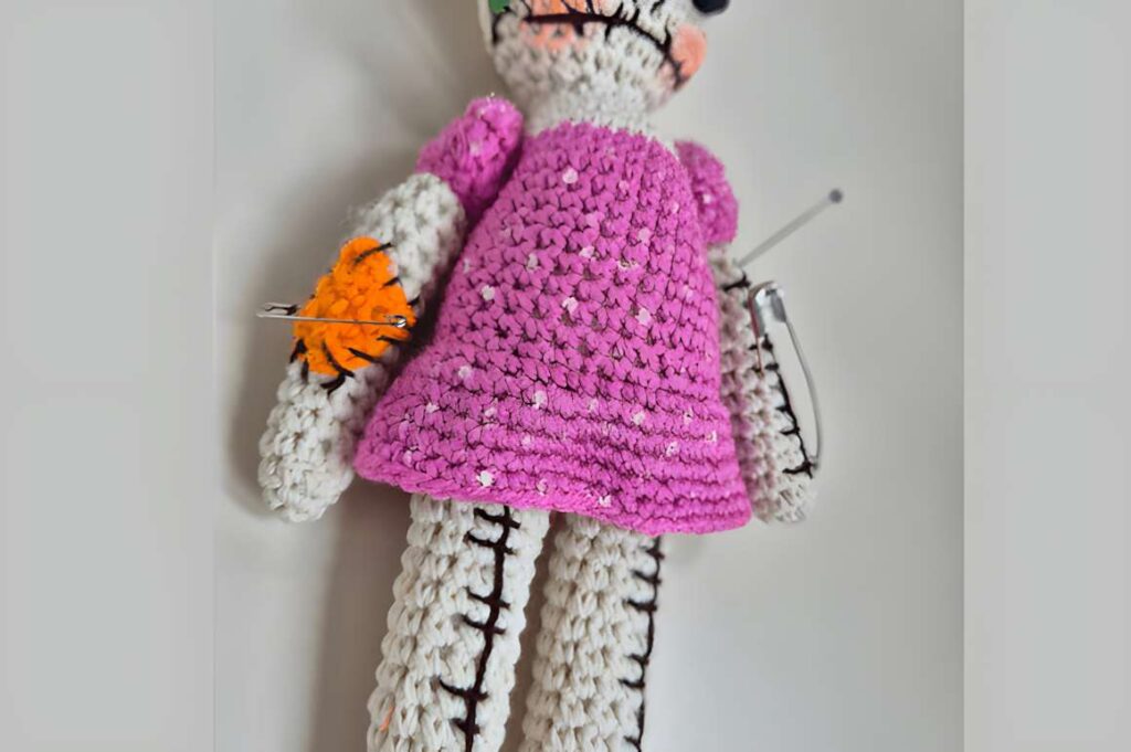 Amigurumi Voodoo Doll with pink dress and accessories, showcasing unique crochet design. — amigurumi crochet patterns