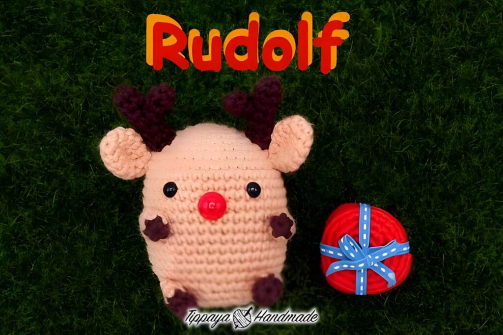 Amigurumi crochet patterns featuring a reindeer and a gift, perfect for Christmas.