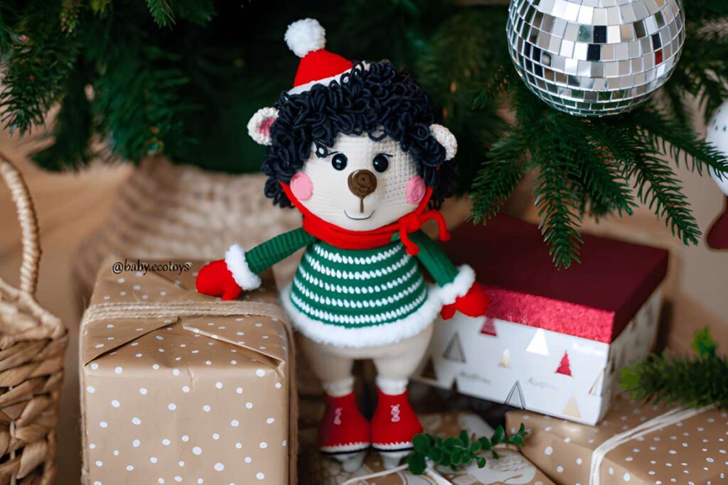 Amigurumi crochet patterns featuring a Christmas Hedgehog in festive attire.